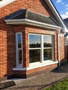 Newly renovated home featuring new windows and front door, including uPVC bay sash windows