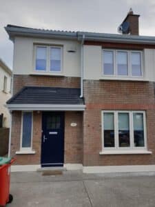 Front view of home with pvc windows and composite door