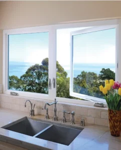 casement window in front of the kitchen sink