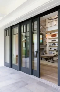 Open multi-slide door providing a view of the living room,